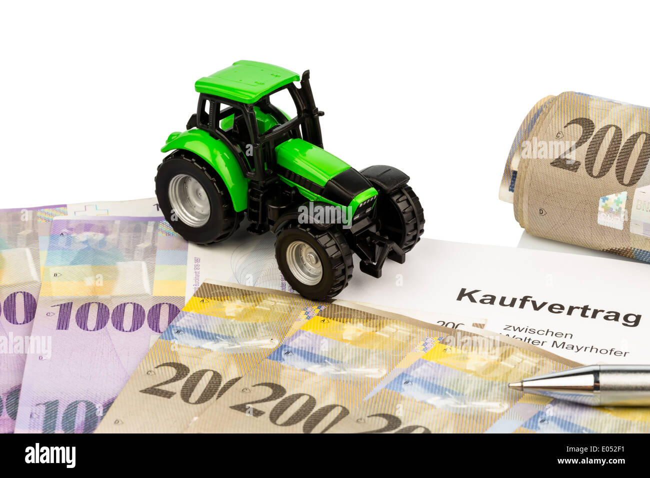 The bill of sale for a new tractor with a Swiss car dealer. With Swiss franc., Der Kaufvertrag fuer einen neuen Traktor bei eine Stock Photo