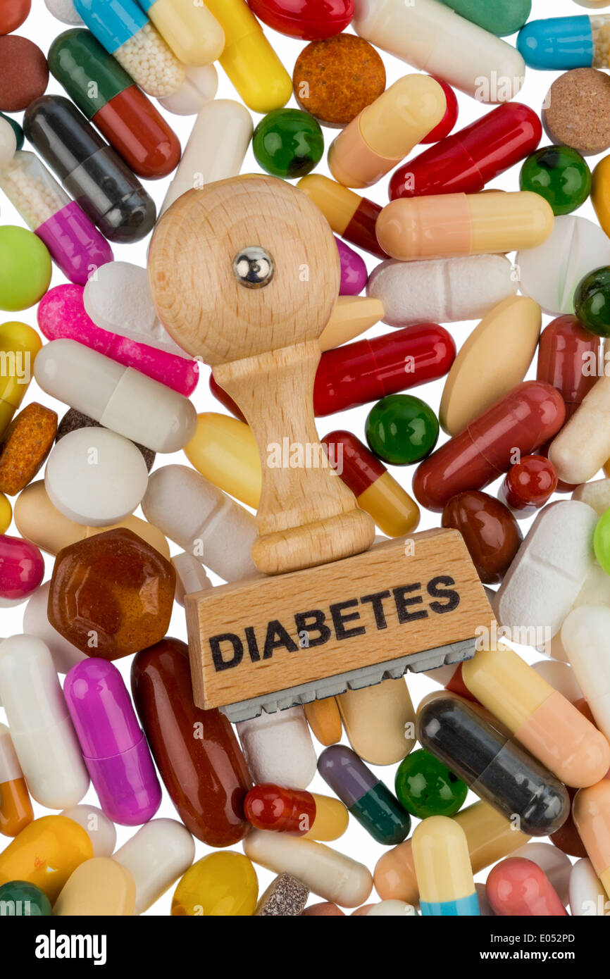 Stamp on coloured tablets, symbolic photo for diabetes,  Verschreibungspflicht and drugs, Stempel auf bunten Tabletten, Symbolfot  Stock Photo - Alamy