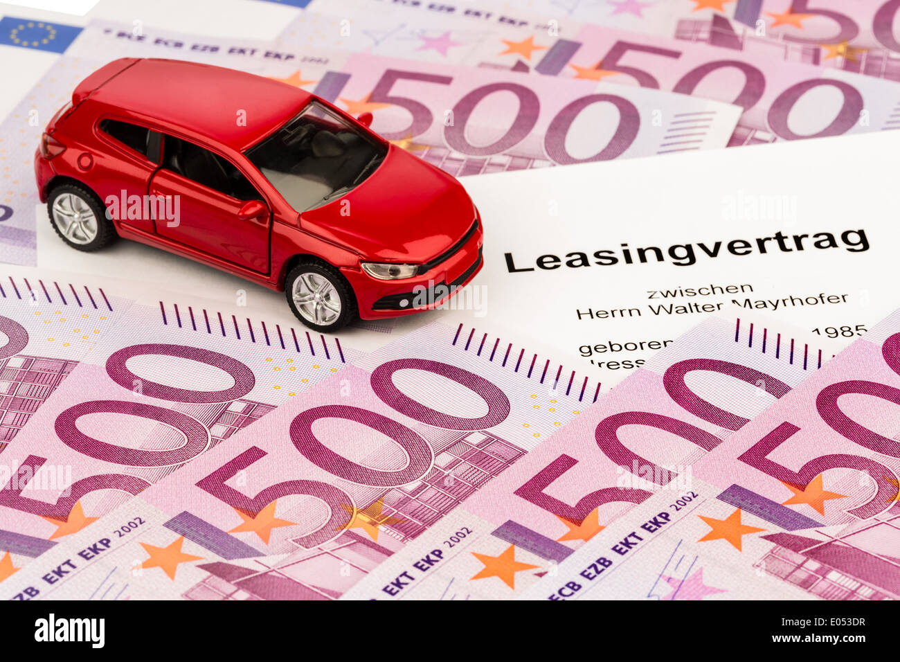 The leasing contract (autoleasing) for a new car with the car dealer, Der Leasingvertrag (Autoleasing) fuer ein neues Auto beim Stock Photo