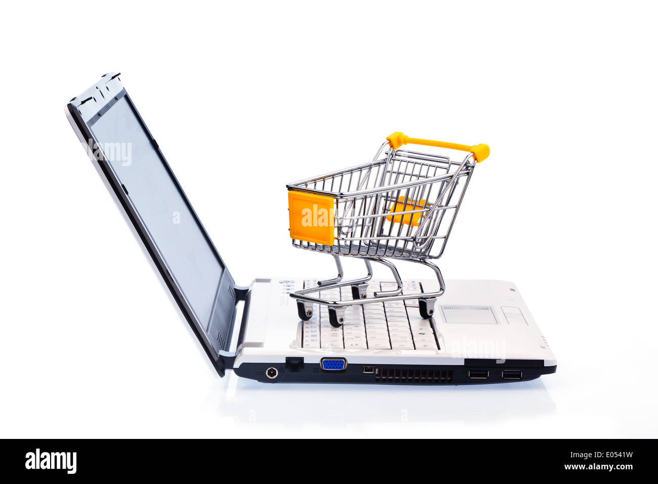 A shopping cart and a computer keyboard. Symbolic photo on-line shopping, Ein Warenkorb und eine Computer Tastatur. Symbolfoto O Stock Photo