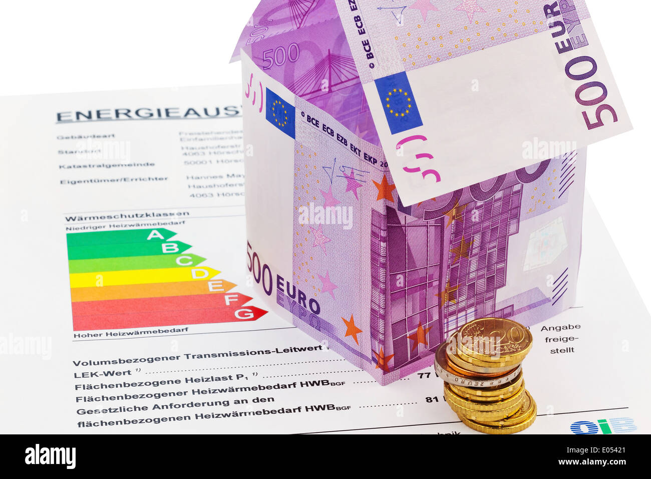 A house seem built from euromoney and an energy identity card. Construction saving, building of a house and house purchase., Ein Stock Photo