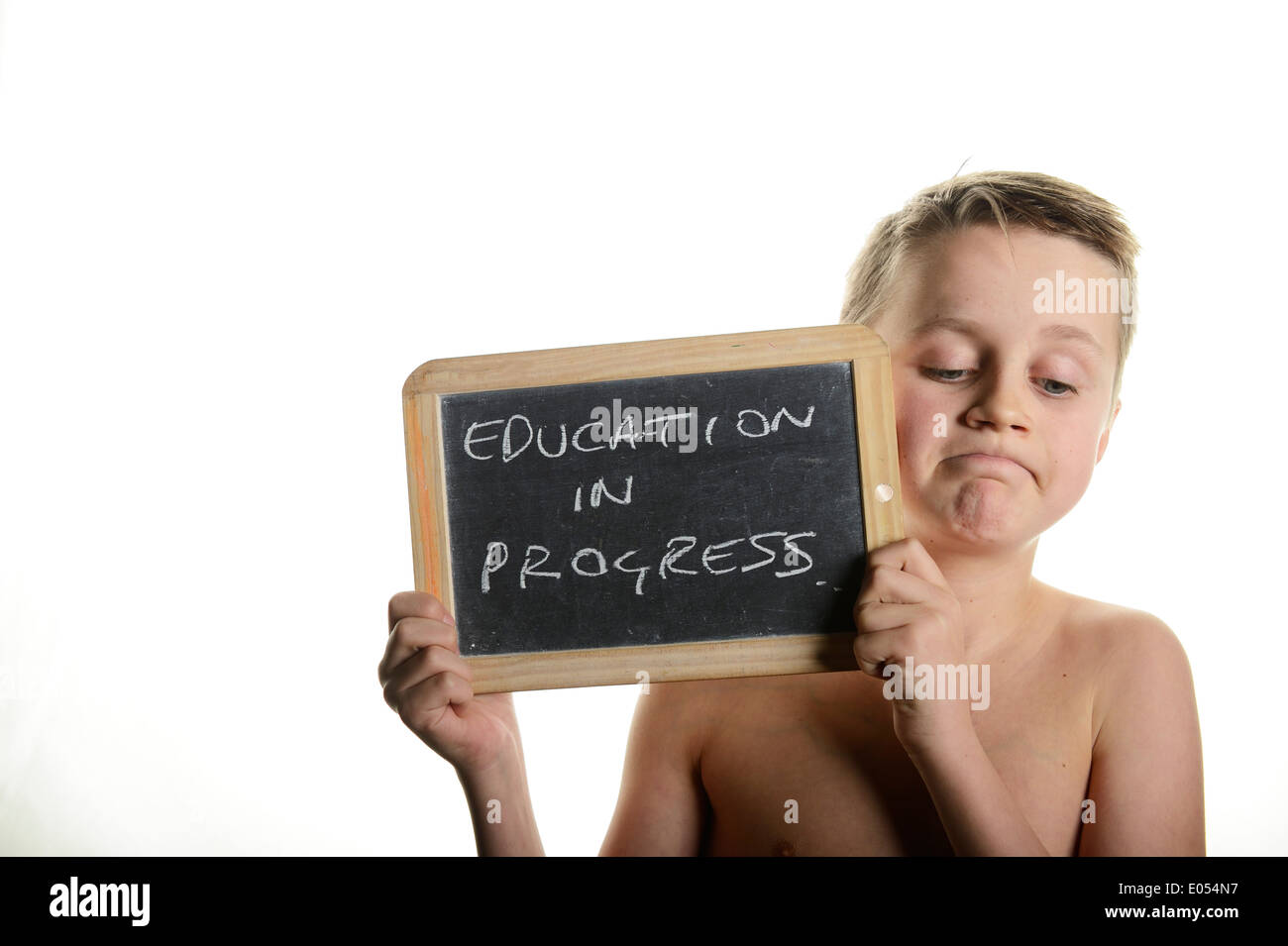 Stock photo of a young teenage boy holding a sign saying education in ...