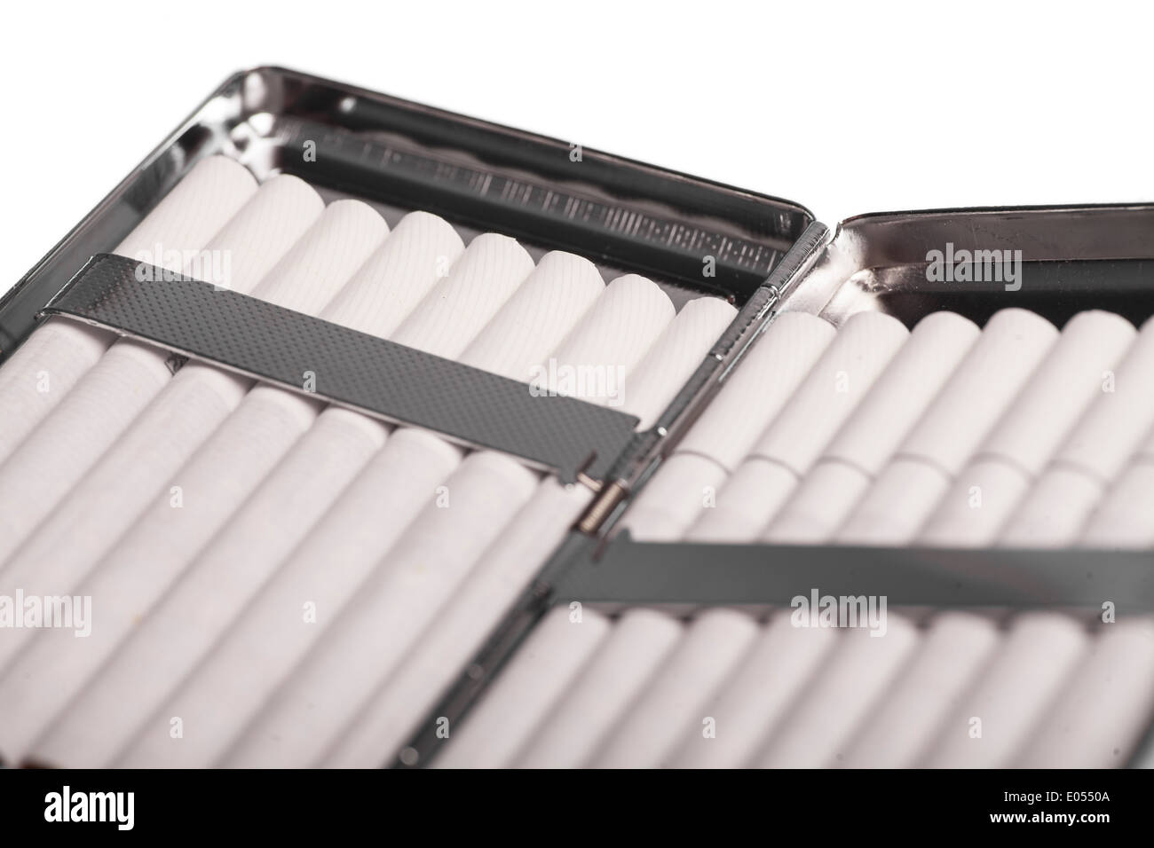 Color detail of a cigarette case with white cigarettes. Stock Photo