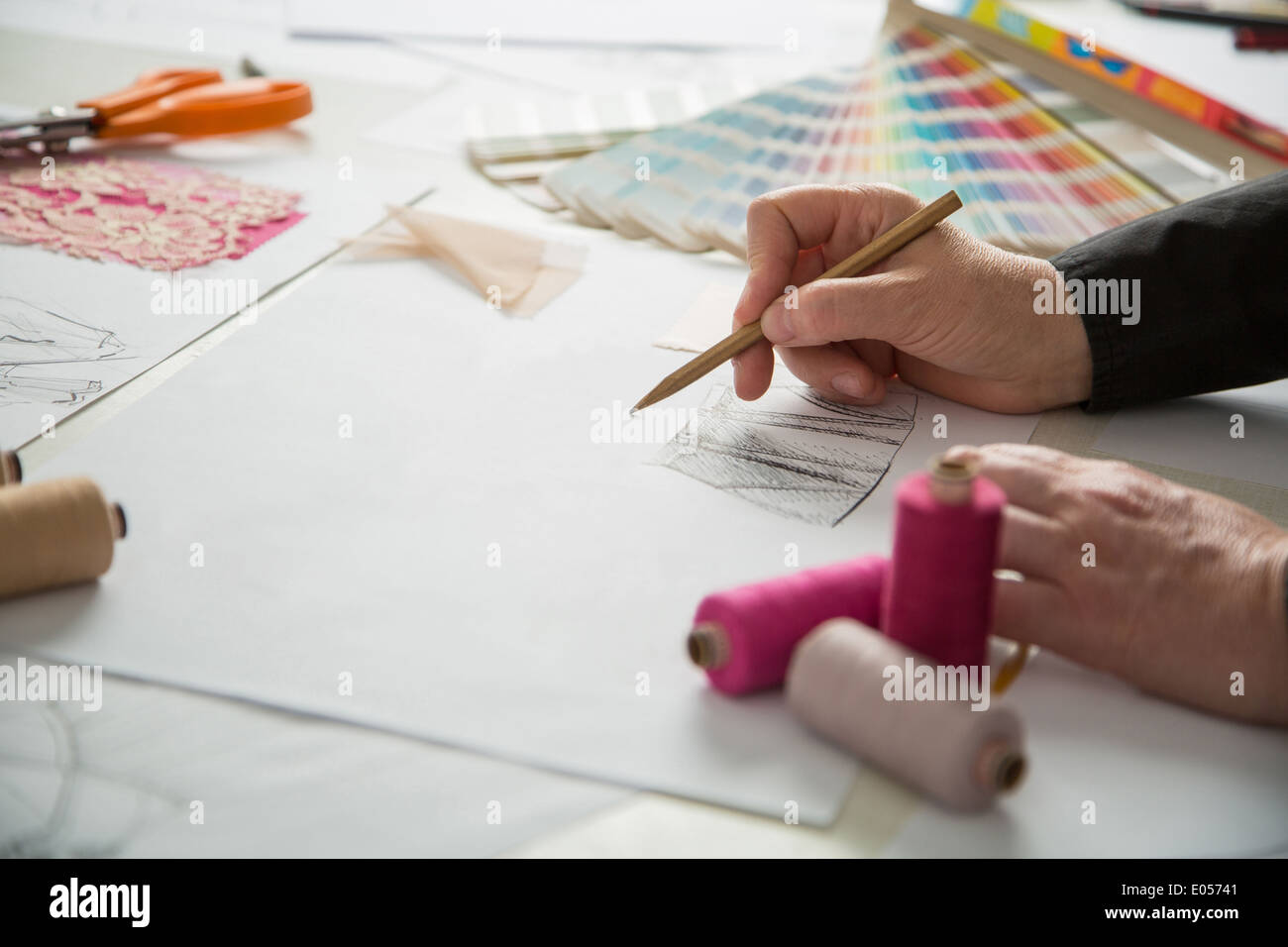 fashion designers, working in progress on tailor table Stock Photo