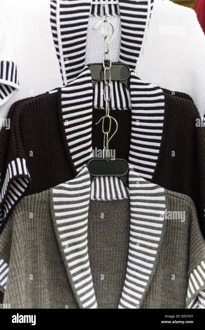 Several waistcoats in the colours knows, grey and black., Mehrere Westen in der Farben weiss, grau und schwarz. Stock Photo