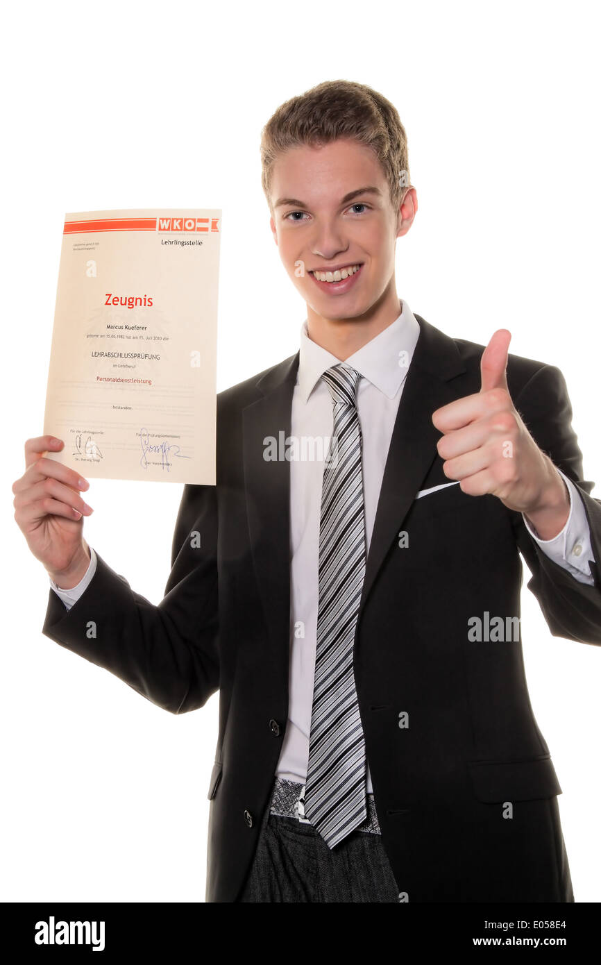 A young man passes successfully teaching final examination, Ein junger Mann besteht erfolgreich Lehrabschlusspruefung Stock Photo