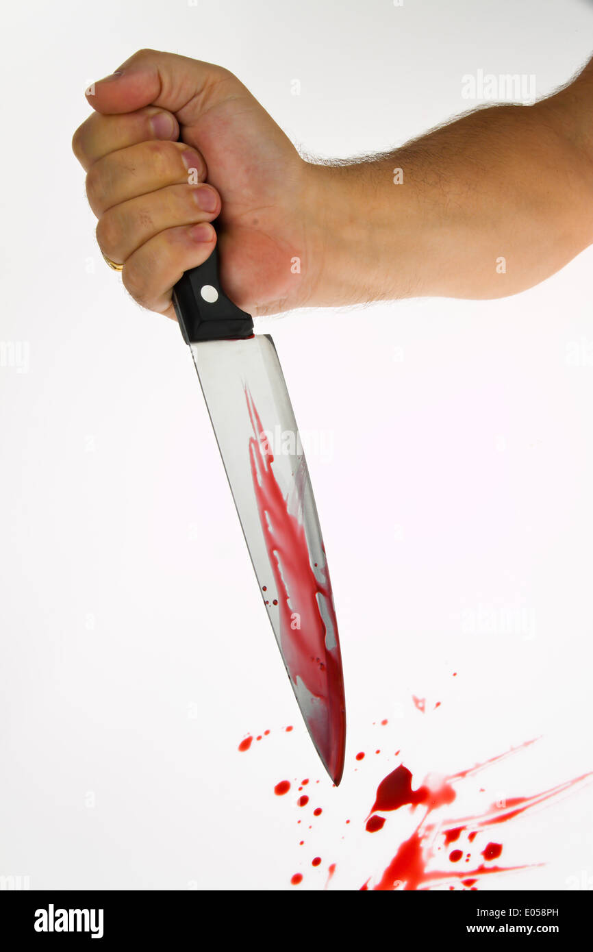 A knife with blood smears. Action weapon of a murder. Symbolic photo criminal activity, Ein Messer mit Blut verschmiert. Tatwaff Stock Photo