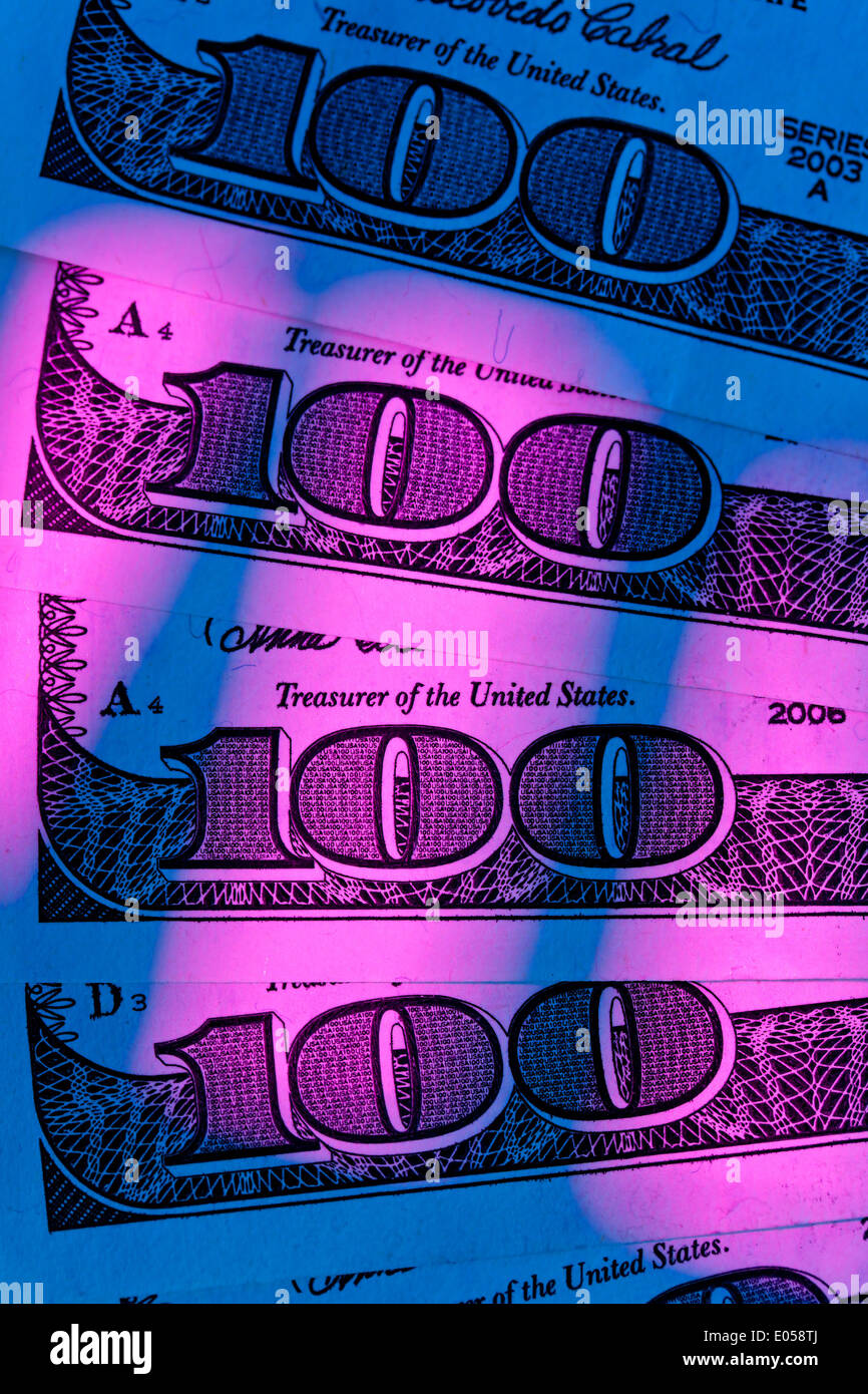 Detail of American dollar of bank notes. With coloured lighting, Detail von amerikanischen Dollar Geldscheinen. Mit bunter beleu Stock Photo