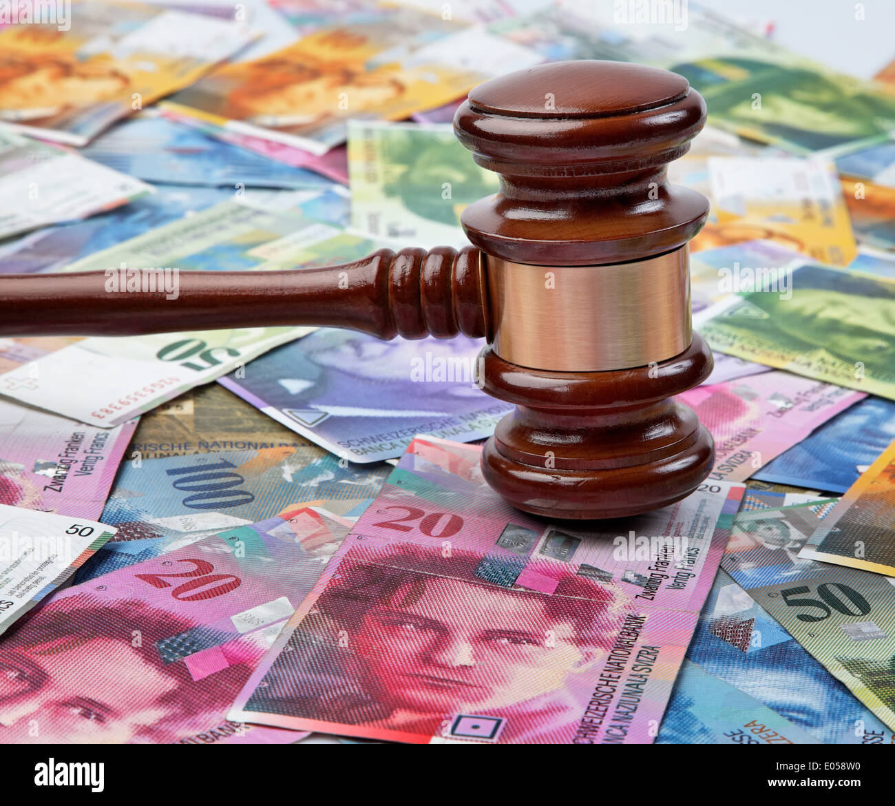 Money Swiss franc and a judge Hammer. Legal costs in Switzerland, Geld Schweizer Franken und ein Richter Hammer. Rechtskosten in Stock Photo