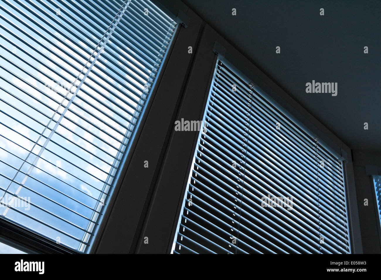 Venetian blinds window as a solar protection, heat protection. Sky behind  lamellae, Jalousien Fenster als Sonnenschutz, Hitzesch Stock Photo - Alamy