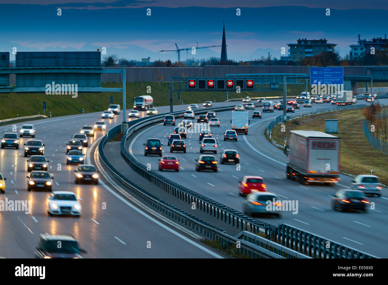 Cars in the traffic on a highway in the evening, Autos im Verkehr auf einer Autobahn am Abend Stock Photo