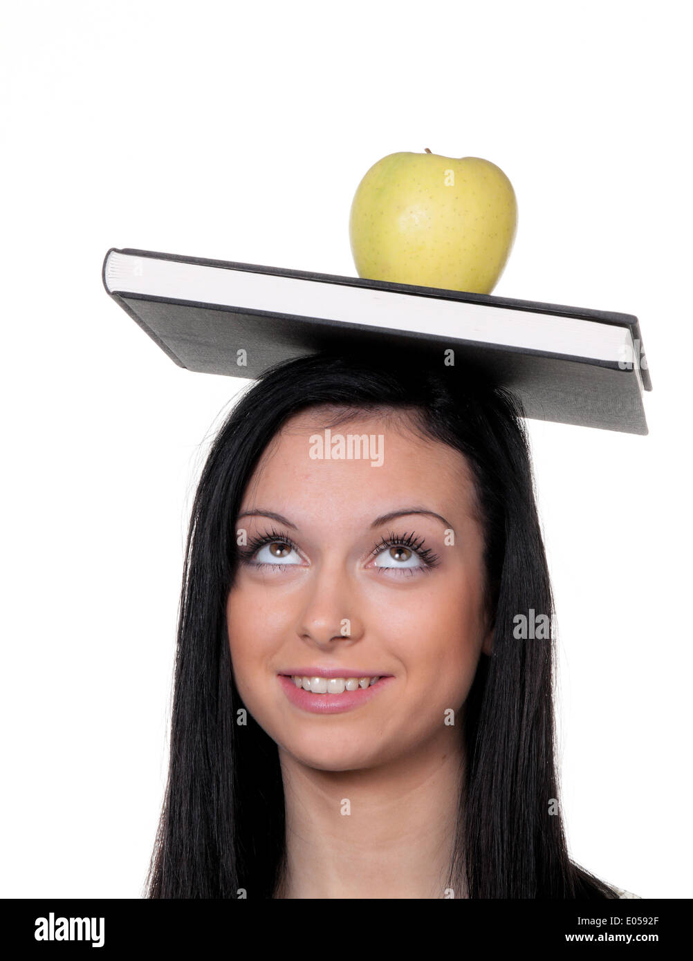 Student with apple and book with learn, Studentin mit Apfel und Buch beim lernen Stock Photo