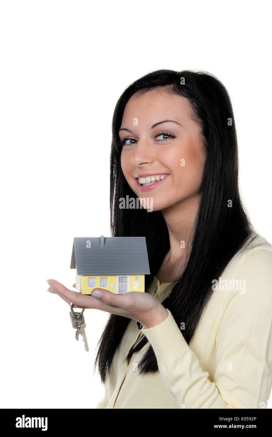 Woman with real estate and key after house purchase, Frau mit Immobilie und Schluessel nach Hauskauf Stock Photo