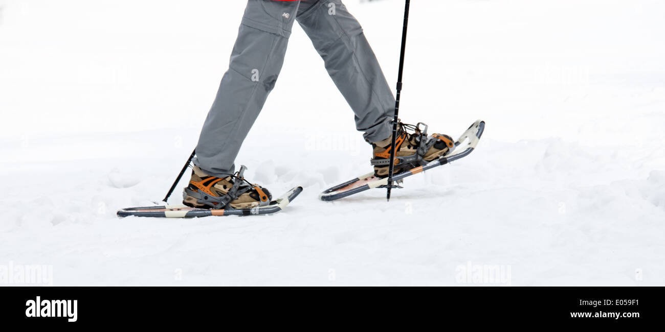 ? ?lterer man in winter with the snow shoe walking, ƒlterer Mann im Winter beim Schnee Schuh Wandern Stock Photo
