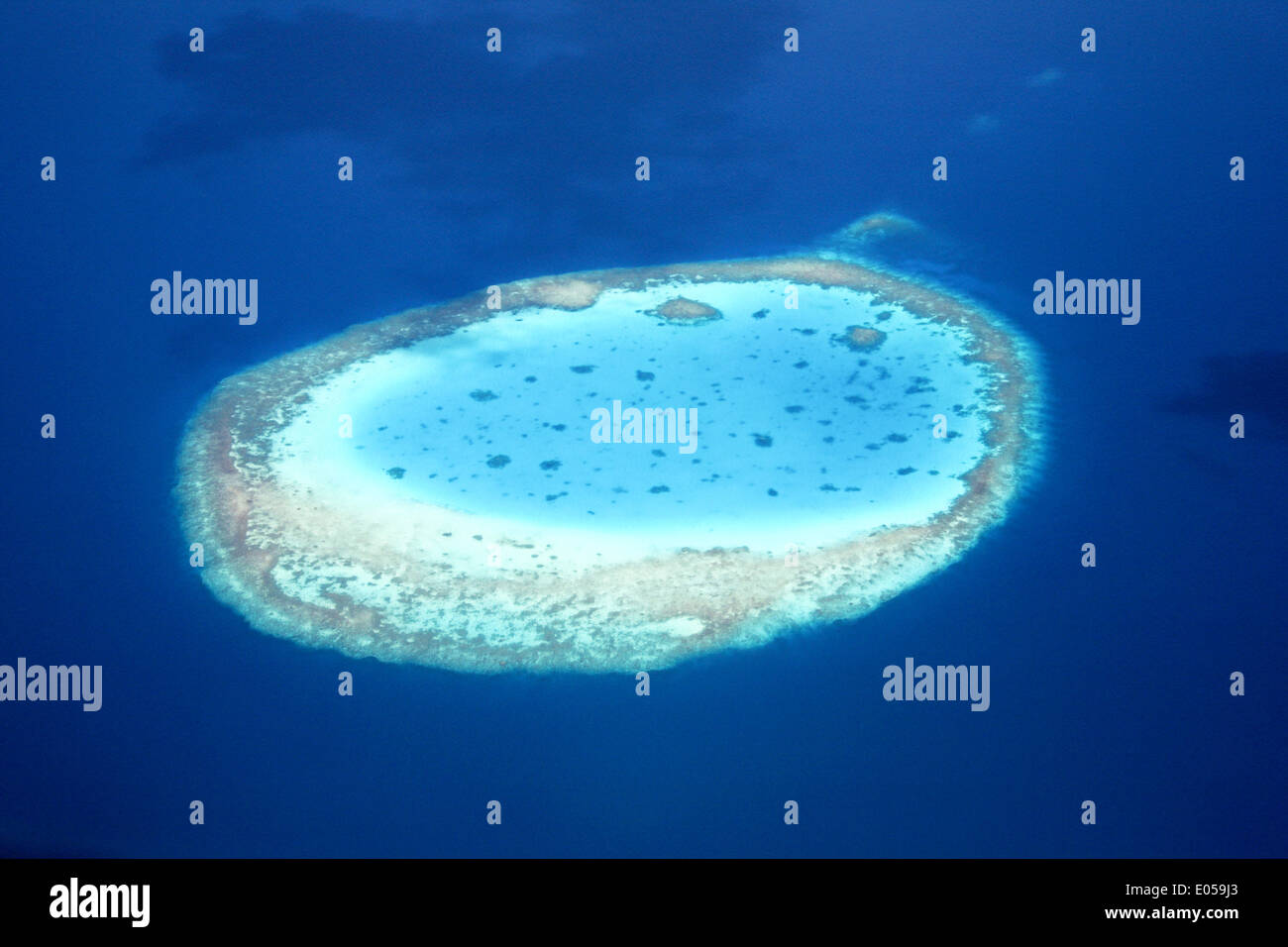 Aerial photo of an atoll in the azure the blue South Pacific, Luftaufnahme eines Atolls in der azur blauen Suedsee Stock Photo
