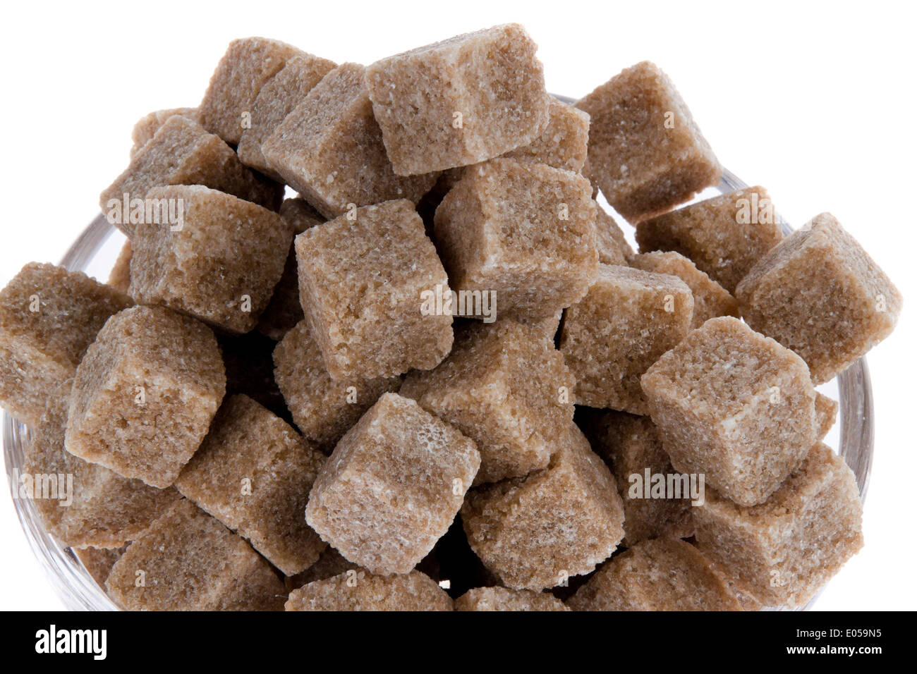 Brown sugar. Injurious food by carbohydrate, Brauner Zucker. Ungesunde Ernaehrung durch Kohlehydraten Stock Photo