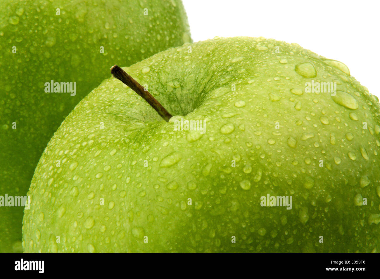 A green apple. Fruit for vitamins., Ein gruener Apfel. Obst fuer Vitamine. Stock Photo