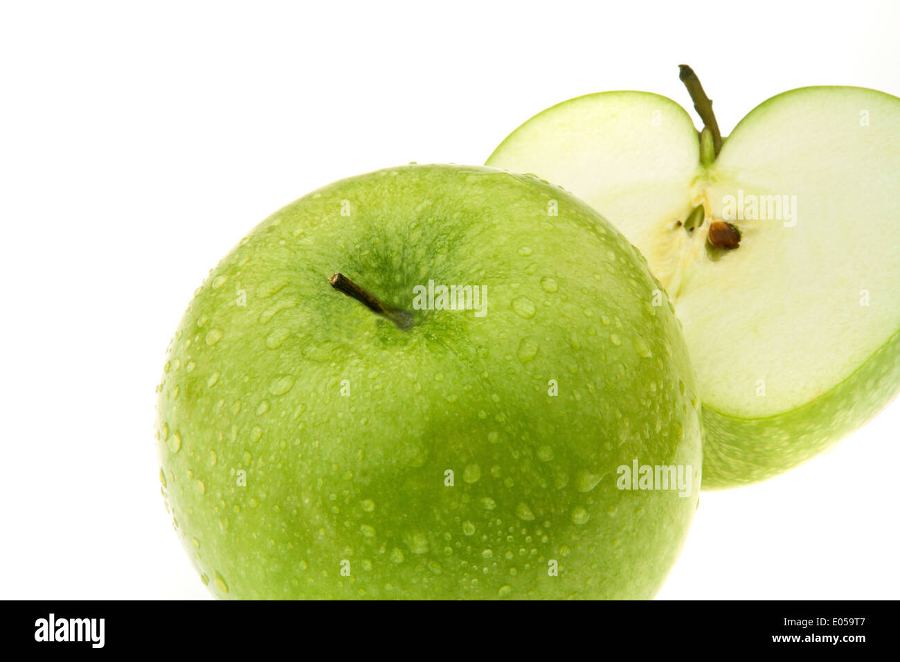 A green apple. Fruit for vitamins., Ein gruener Apfel. Obst fuer Vitamine. Stock Photo