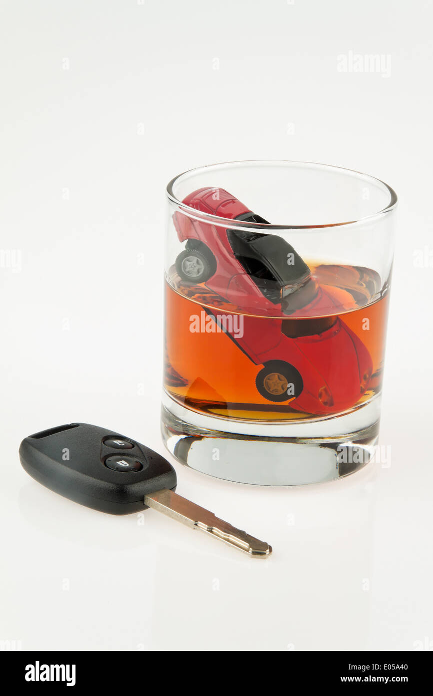Alcohol and car. Alkolenker. Drunk motoring., Alkohol und Auto. Alkolenker. Betrunken Autofahren. Stock Photo