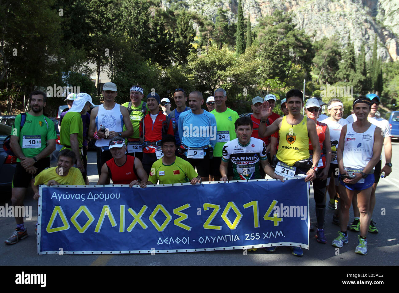 Athens. 2nd May, 2014. Participants in the 3rd Dolichos Ultra Marathon race pose for photograph at the starting point in front of the archaeological site of Delphi in central Greece on May 2, 2014. A total of 26 athletes, among them a Chinese, aim to run nonstop to Sunday afternoon the 255 kilometers course to Olympia, the birthplace of the Olympic Games. © Marios Lolos/Xinhua/Alamy Live News Stock Photo