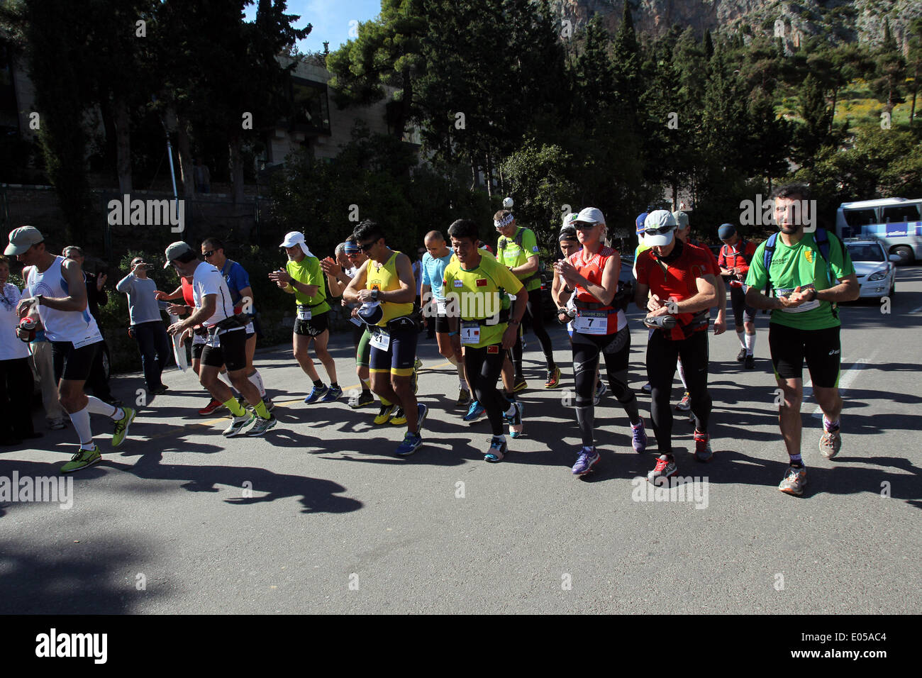 Athens. 2nd May, 2014. Participants in the 3rd Dolichos Ultra Marathon starts running in front of the archaeological site of Delphi in central Greece on May 2, 2014. A total of 26 athletes, among them a Chinese, aim to run nonstop to Sunday afternoon the 255 kilometers course to Olympia, the birthplace of the Olympic Games. © Marios Lolos/Xinhua/Alamy Live News Stock Photo