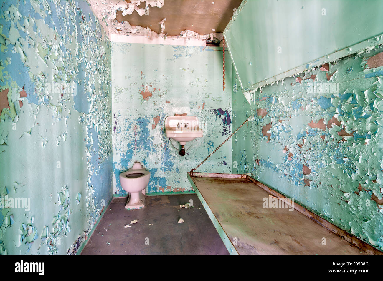 Old Prison cell with pealing paint on the walls Stock Photo