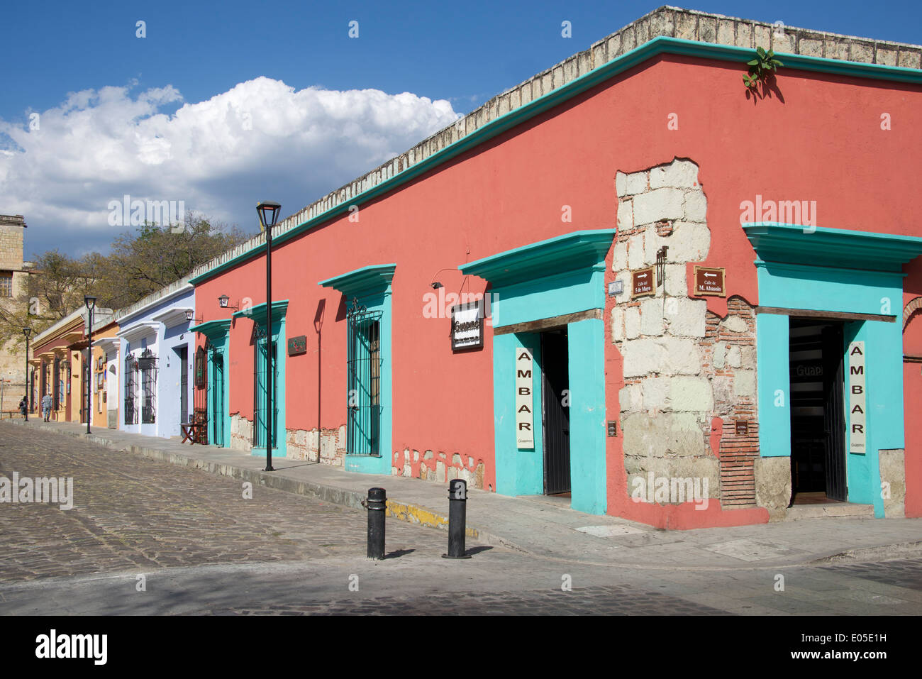 Restored buildings quiet cobbled stone street Calle 5 de Mayo Oaxaca City Mexico Stock Photo