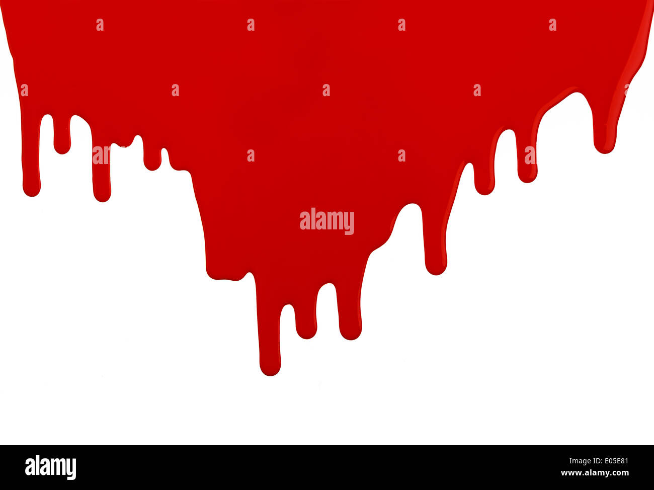 Red Latex Paint Running Dripping Down Wall with Copy Space on White Background. Stock Photo