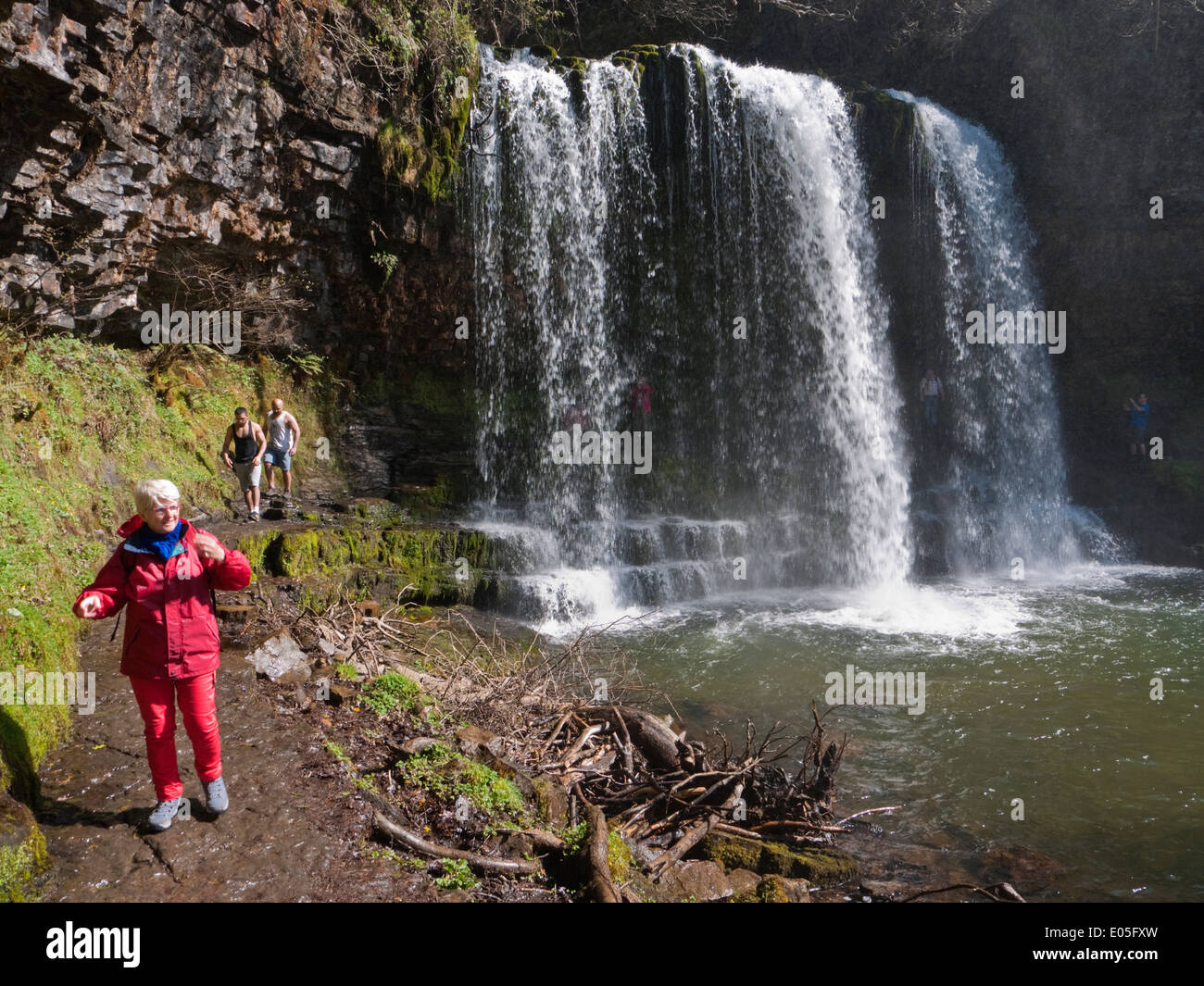 Walking behind the popular Sgwd yr Eira waterfall in Brecon Beacons ...
