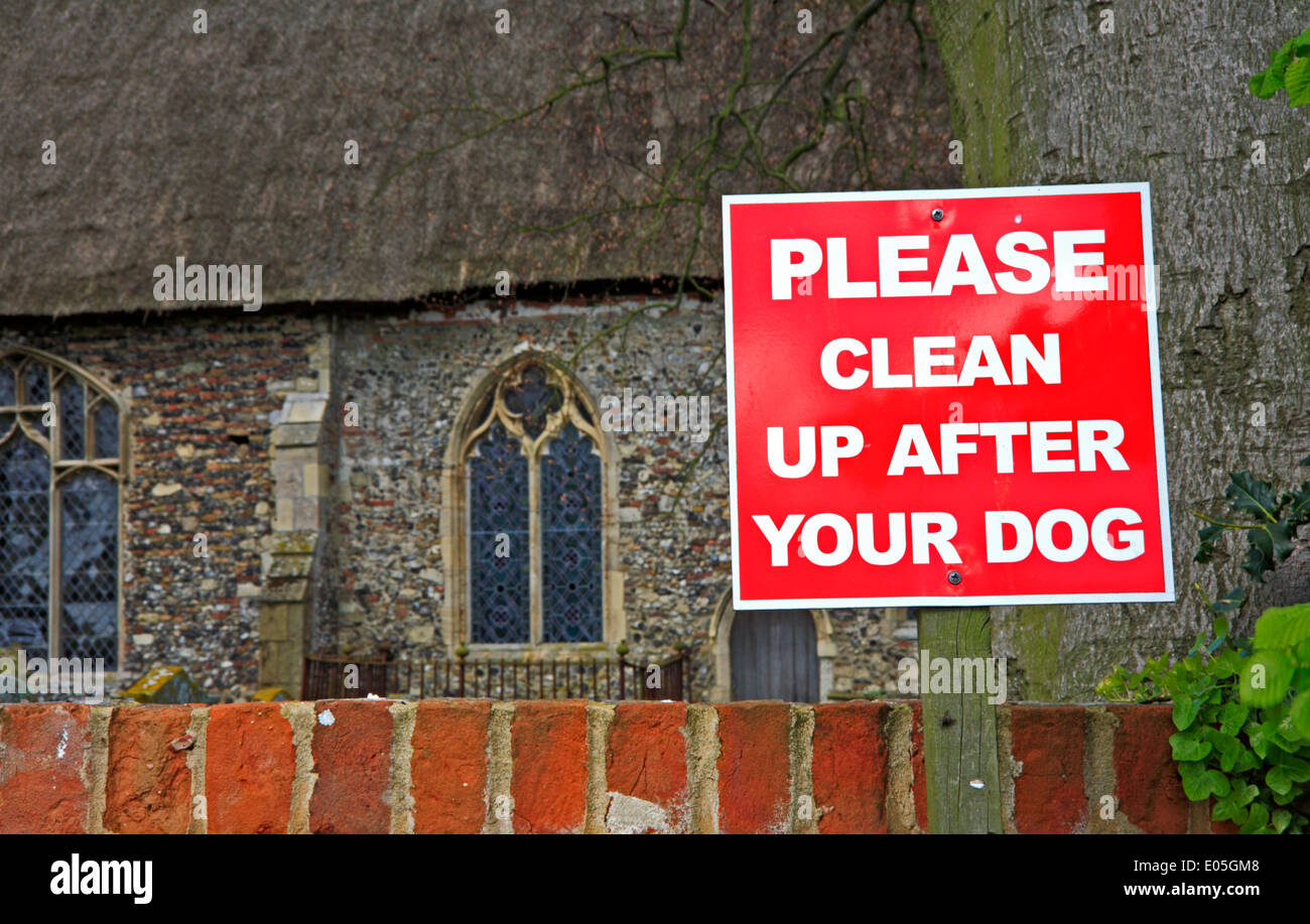 Clean up after your dog sign by Stokesby Church, Norfolk, England, United Kingdom. Stock Photo
