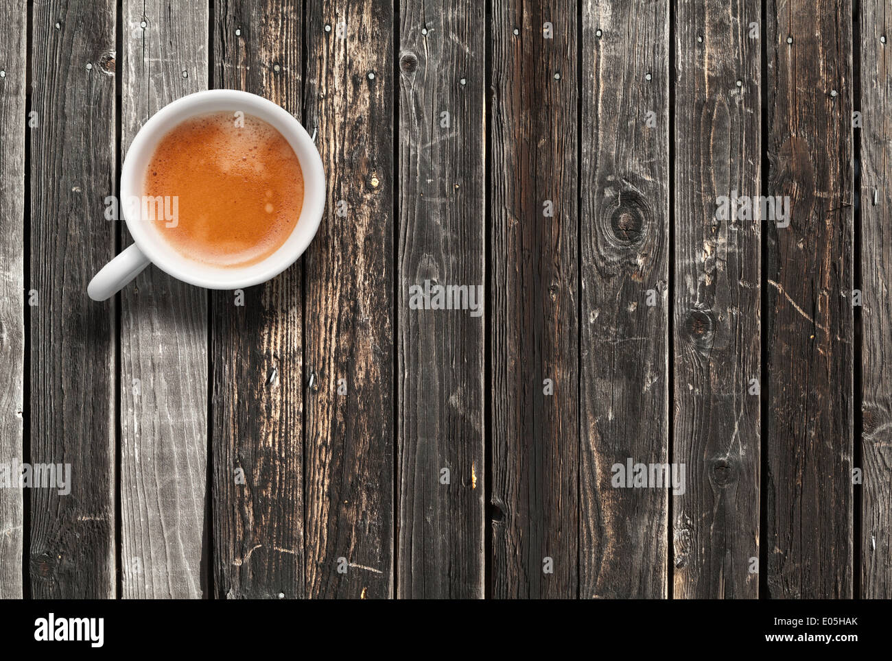 White coffee cup, top view on dark wooden table background Stock Photo