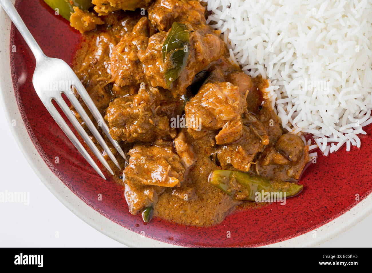 Chettinadu traditional Indian chicken bonein curry, served with white