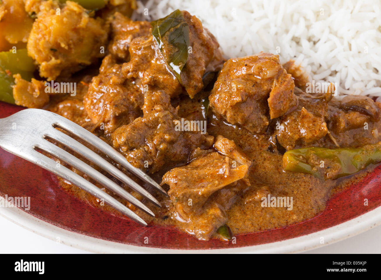 Chettinadu traditional Indian chicken bonein curry, served with white