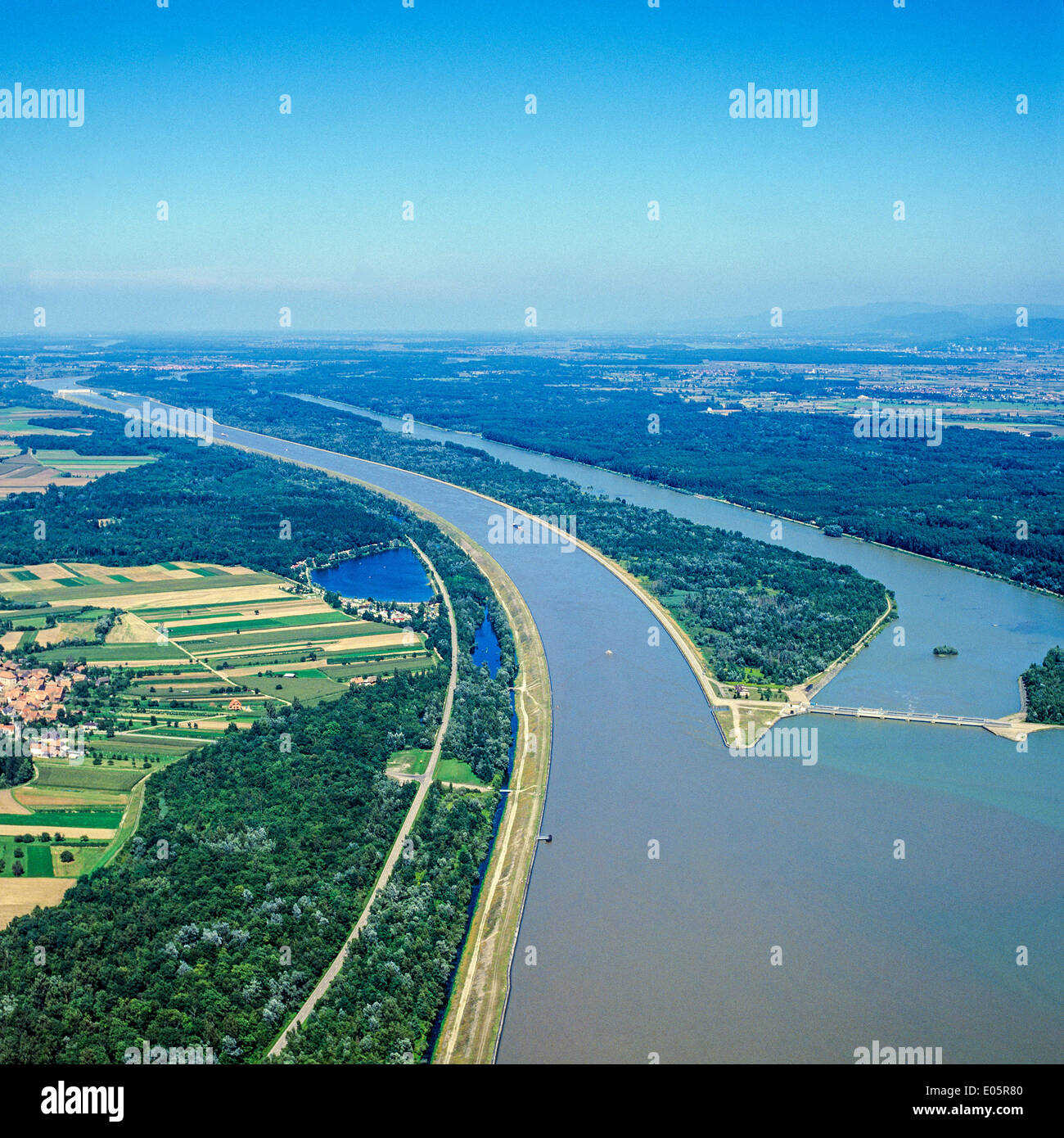 Aerial view of confluence of Grand Canal d'Alsace and upper Rhine river ...