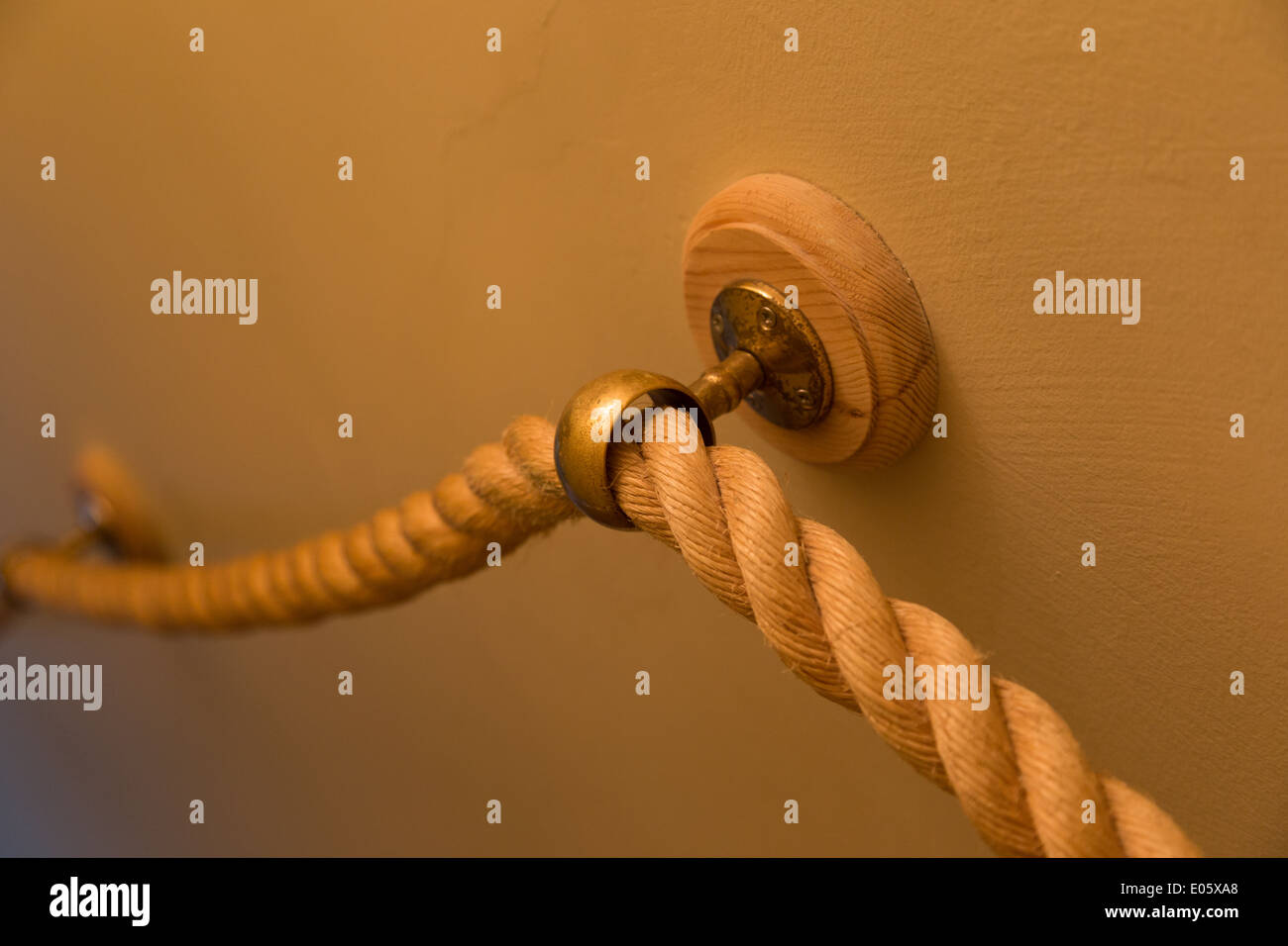 A rope stair banister in a nautically themed house Stock Photo