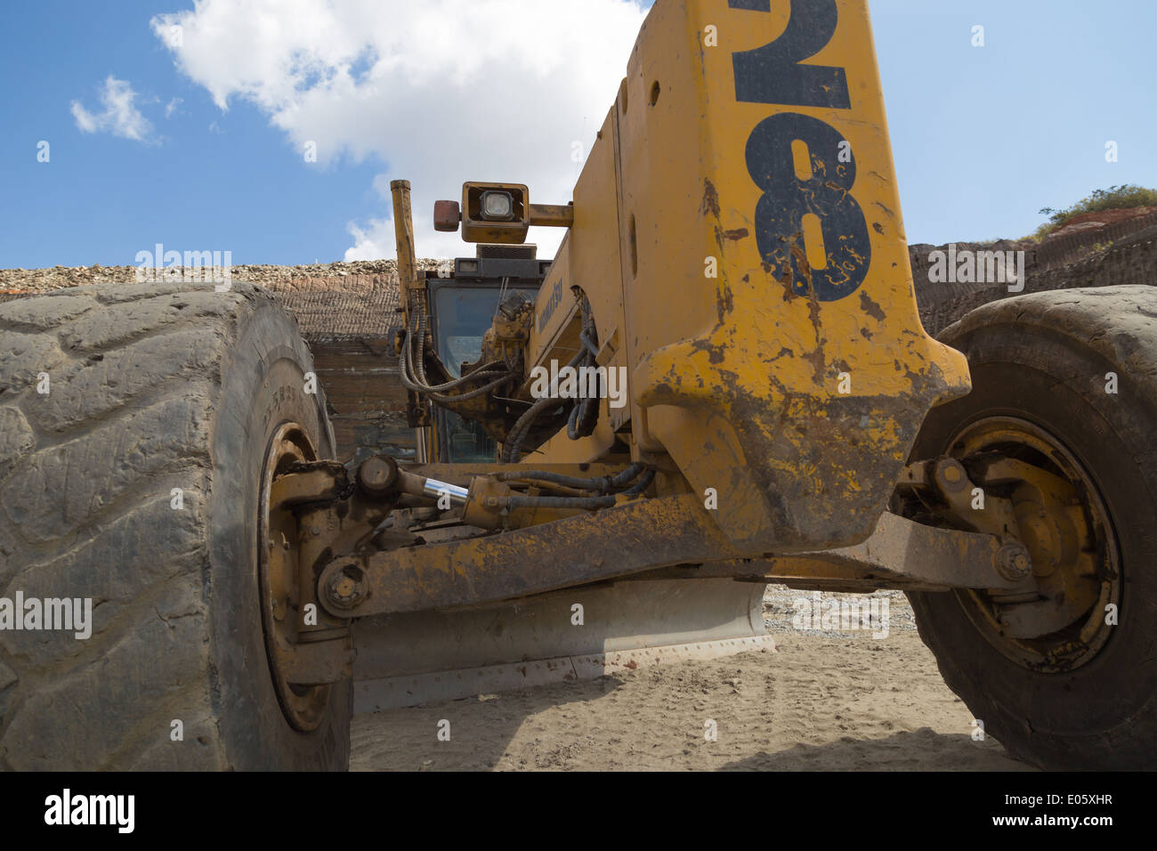 Komatsu mining machinery parked up during shift change in a large African open cast copper mine Stock Photo