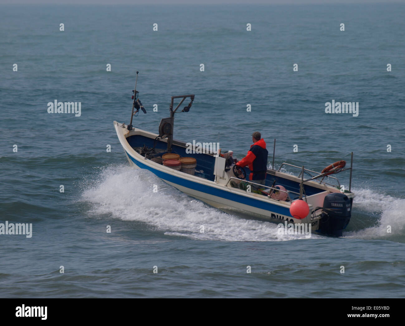 Commercial fisherman heading out to sea, Bude, Cornwall, UK Stock Photo