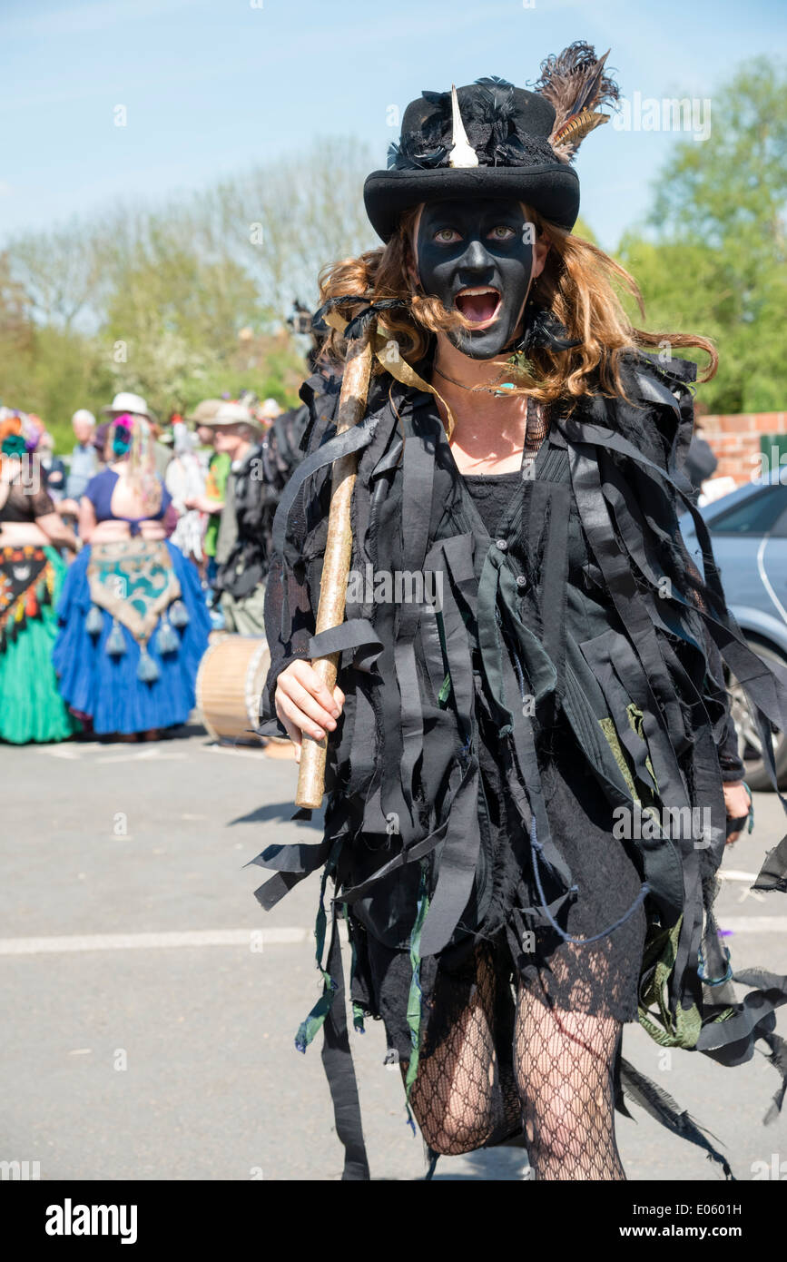 Female morris dancer with a black face shouting or screaming, Upton upon Severn, UK. Stock Photo