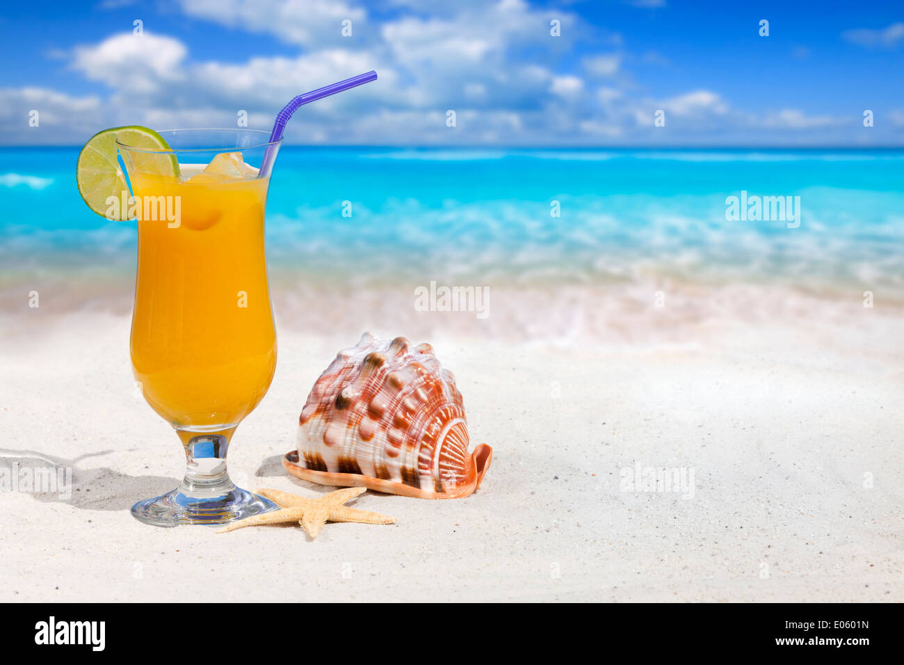 Fruit Cocktail with Orange and Drinking Straw on the Beach with ...