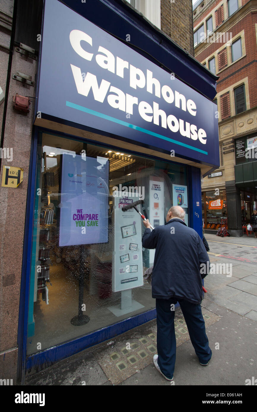 Carphone warehouse with Window cleaner Stock Photo