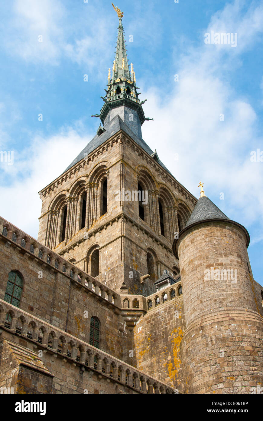 Partial view of Mont Saint Michel abbey with tower and wall Stock Photo