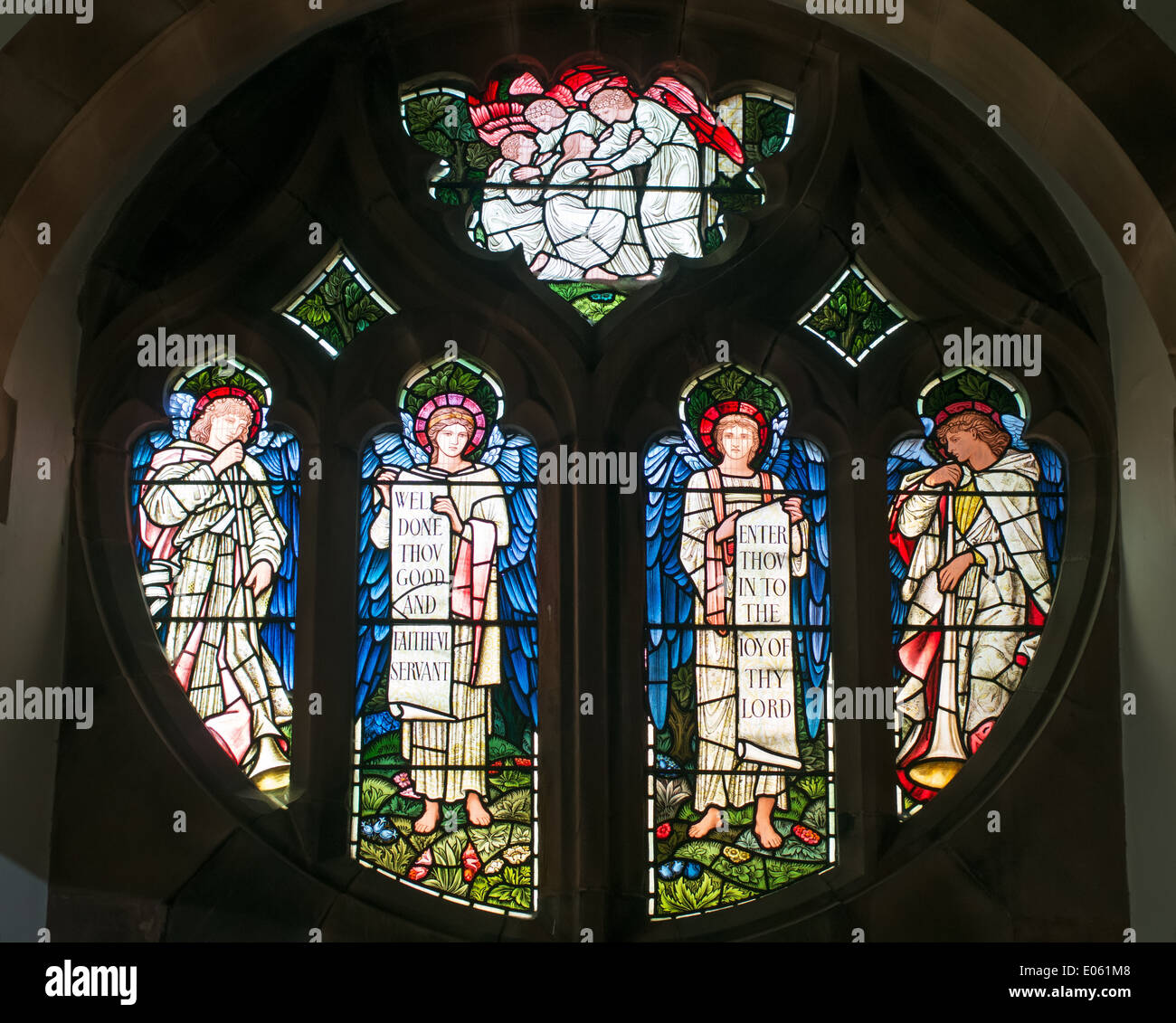 Stained glass memorial window with St Martin's church Brampton, north west England UK Stock Photo