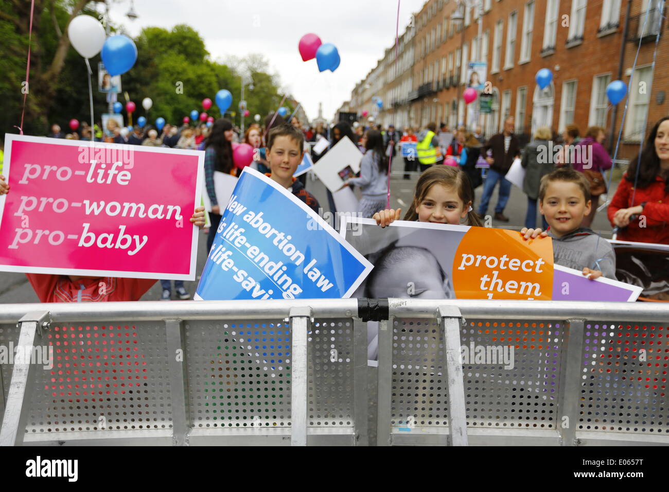 Dublin, Ireland. 3rd May 2014. Four children hold anti-abortion posters at the 'National Vigil for Life'. Thousands turned up for the 'National Vigil for Life' in Dublin's Merrion Square to call politicians for a repeal of the Protection of Life During Pregnancy Bill 2013 which allows abortion in Ireland in limited circumstances. Stock Photo