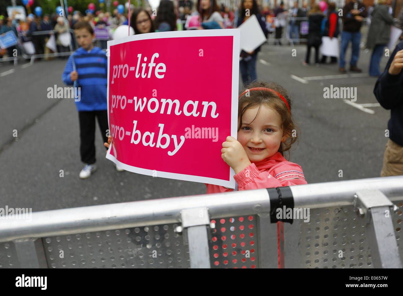 Dublin, Ireland. 3rd May 2014. A little girl holds an anti-abortion poster at the 'National Vigil for Life'.  Thousands turned up for the 'National Vigil for Life' in Dublin's Merrion Square to call politicians for a repeal of the Protection of Life During Pregnancy Bill 2013 which allows abortion in Ireland in limited circumstances. Stock Photo