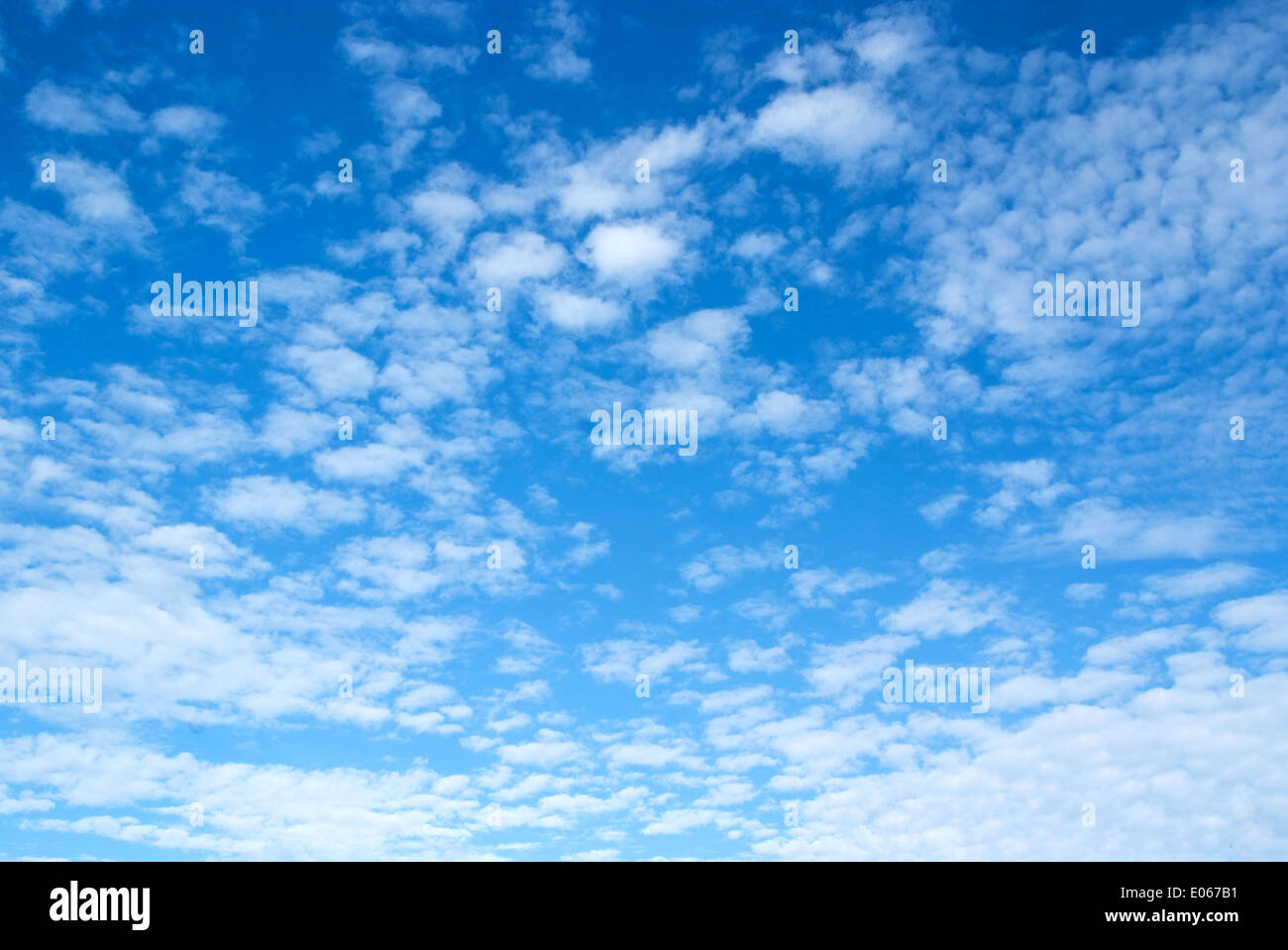 The blue sky and white fluffy clouds Stock Photo - Alamy