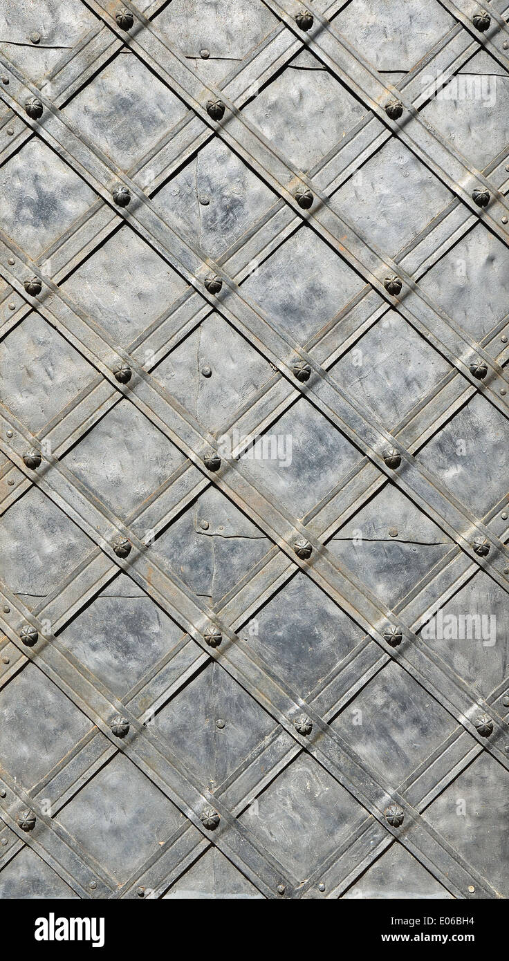 Iron Fitting - Antique fitting made of iron. Fine wrought work, riveted and with diagonal stripes. Stock Photo