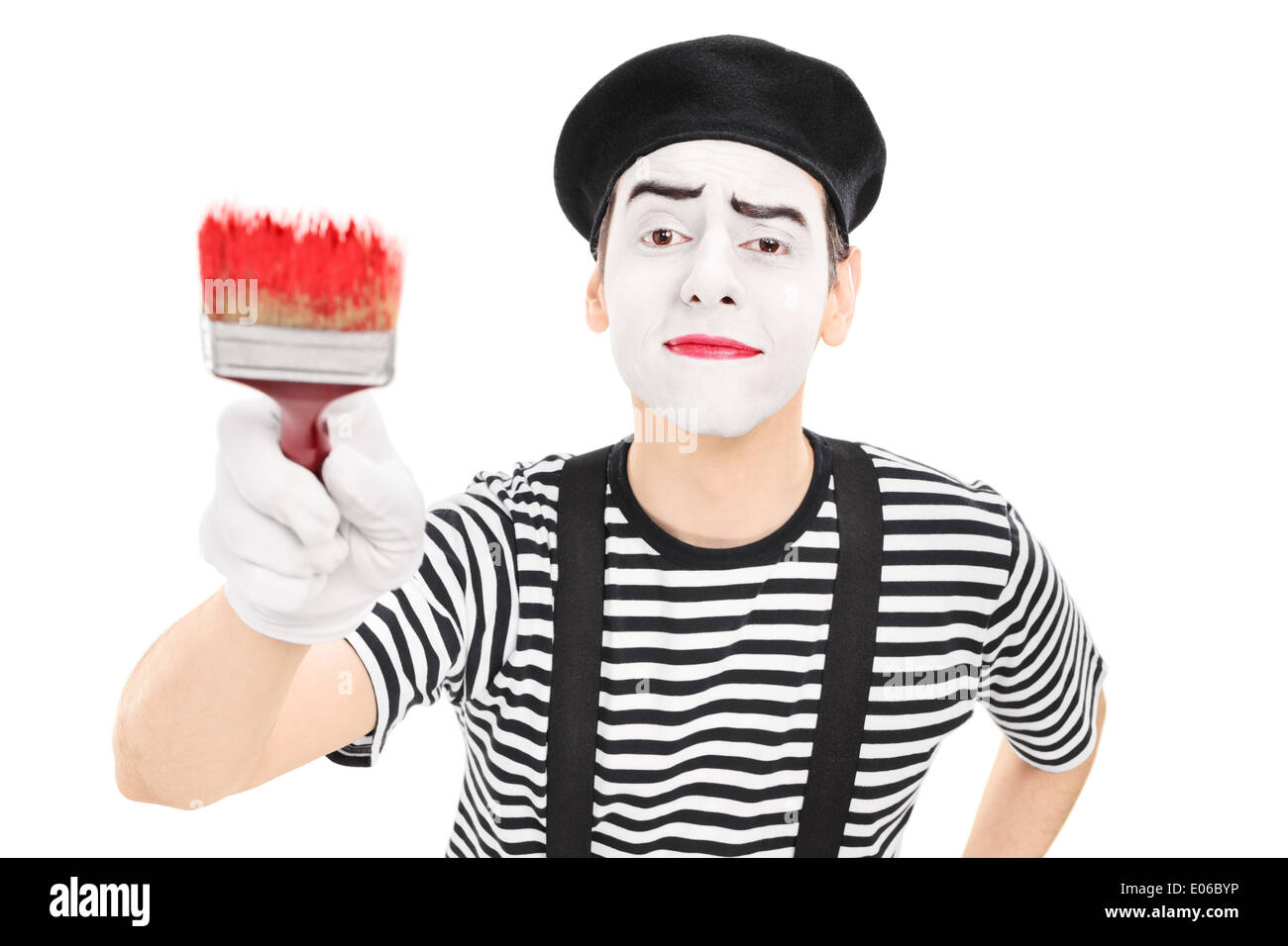 Mime artist holding a paintbrush Stock Photo