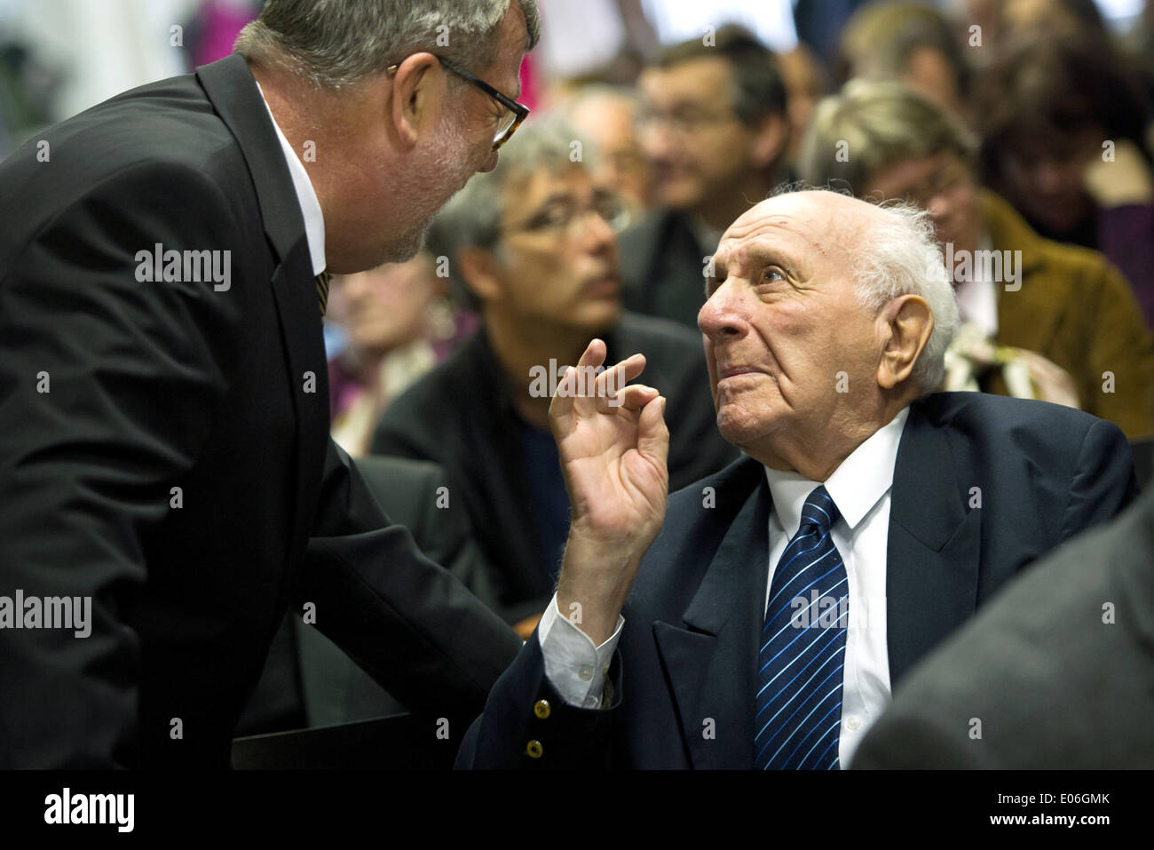 Oranienburg, Germany. 04th May, 2014. Edgar Frischmann, Sachsenhausen concentration camp survivor, talks with Hans-Joachim Laesicke (SPD, L) during the ceremony for the Franz Bobzien Prize for the 69th anniversary of the liberation of Sachsenhausen and Ravensbrueck concentration camps in Oranienburg, Germany, 04 May 2014. The pupils want to turn a former prisoner of war camp into a memorial. The 69th anniversary of the liberation is celebrated on 04 May 2014. Photo: DANIEL NAUPOLD/dpa/Alamy Live News Stock Photo