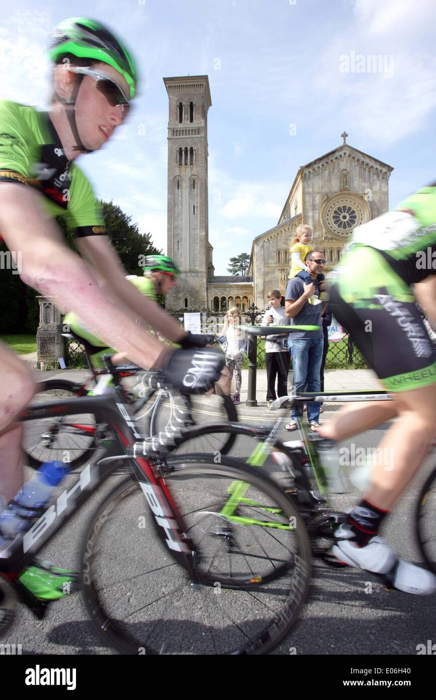 Wilton, UK. 04th May, 2014. LEADING professional cyclists competing in the Cycle Willtshire Grand Prix pass the Italianate Church of St Mary and St Nicholas in Wilton, England, on Sunday 4th May 2014. The Wiltshire Grand Prix is an Elite Cycle Race, covering 101miles/160km through the Wilshire countryside, and is part of the top tier of the British Cycling Calendar attracting top level professional riders in the UK. Credit:  Parkes Photographic Archive/Alamy Live News Stock Photo