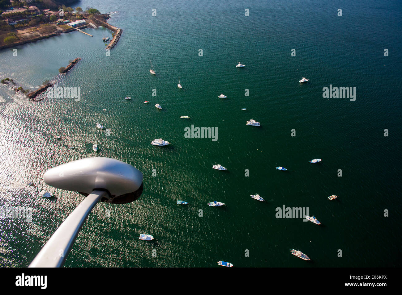 A dramatic coastal aerial view from a gyrocopter of the anchorage of Playa Flamingo, near Tamarindo, Guanacaste, Costa Rica. Stock Photo